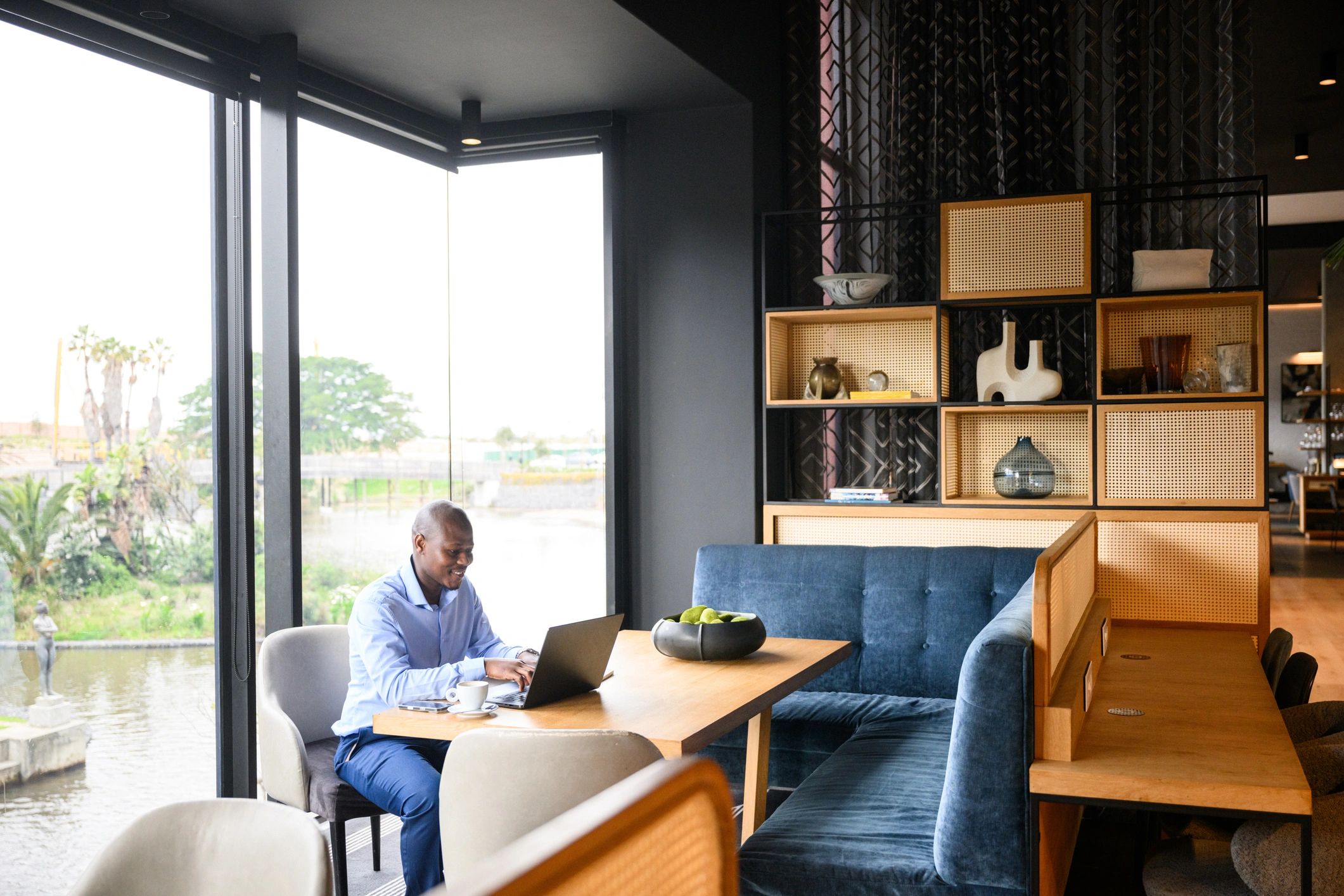 Professional working on a laptop in a modern office